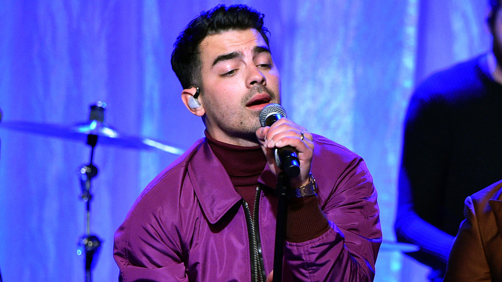 Joe Jonas performing on stage