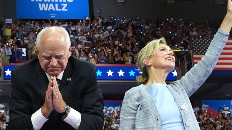 Tim Walz eyes closed while Gwen Walz waves