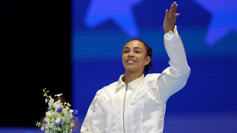 Hezly Rivera in a white jacket with flowers 