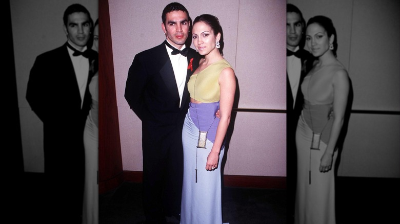 Ojani Noa in tux with Jennifer Lopez in gold and purple dress