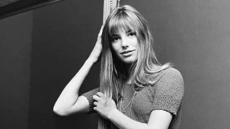 Jane Birkin wearing a necklace smiling