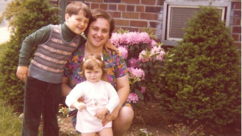 Joe and Tanya Bastianich pose with their mother Lidia in the yard of their home in Queens.