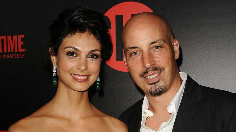 Morena Baccarin and Austin Chick smiling at an event