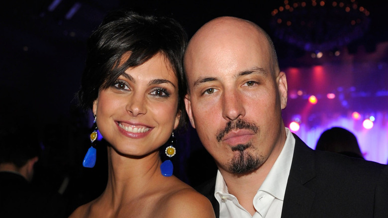 Morena Baccarin and ex-husband Austin Chick posing at an event