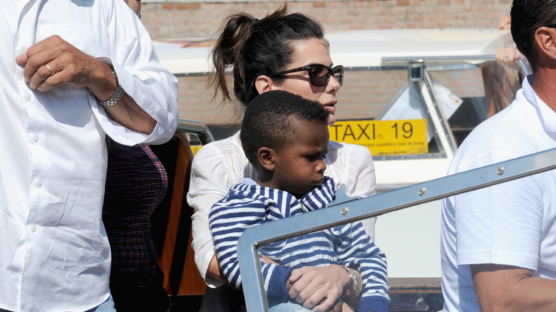 Sandra Bullock and son Louis on a boat