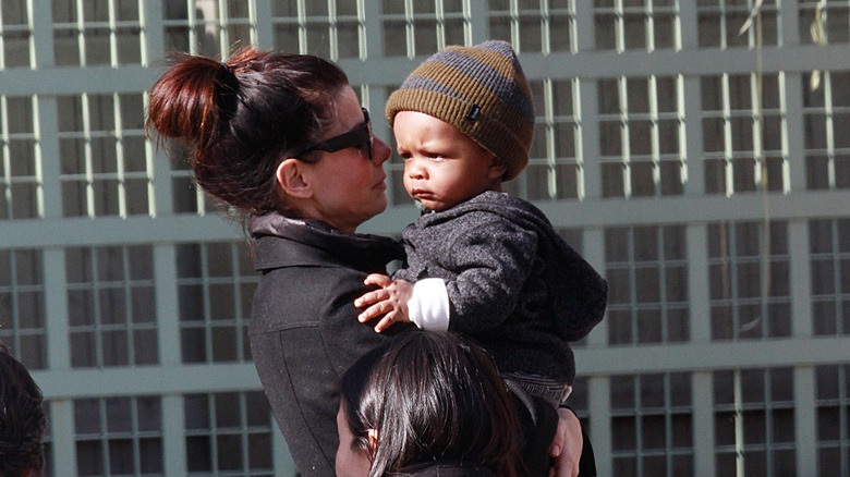 Sandra Bullock carrying son Louis