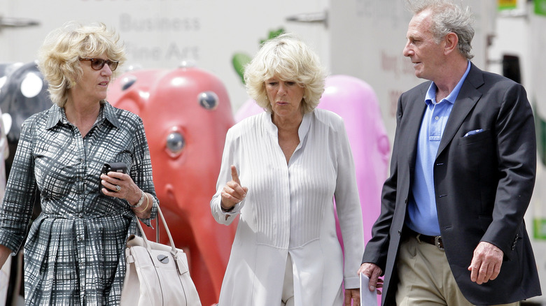 Camilla walking with her siblings