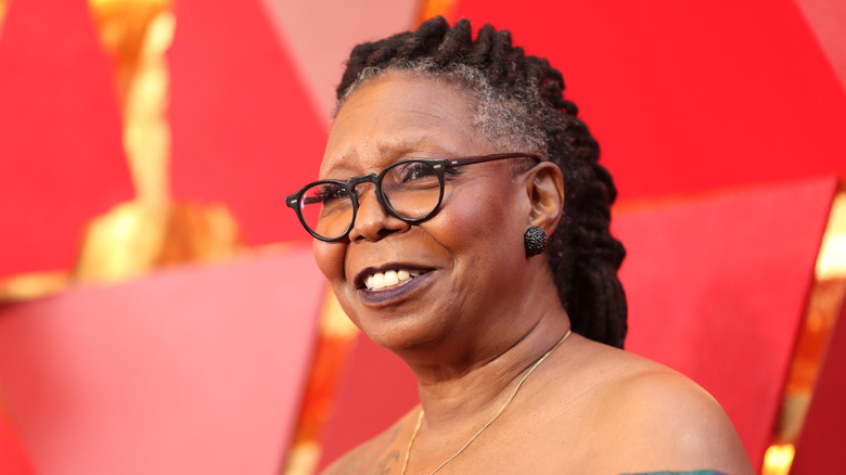 Whoopi Goldberg smiling on the red carpet