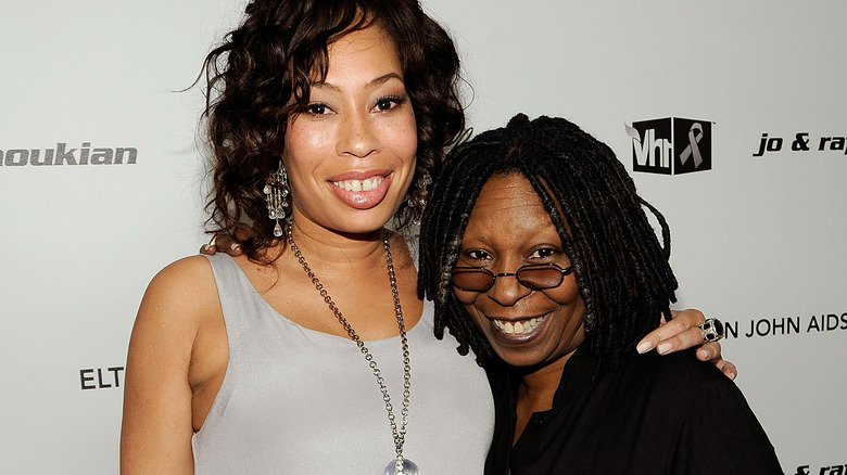 Alex Martin and Whoopi Goldberg smiling