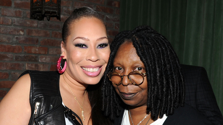 Alex Martin Dean and Whoopi Goldberg posing