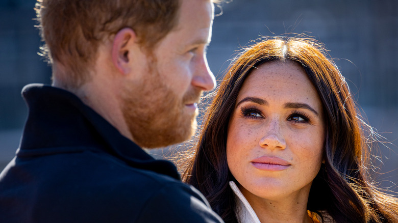 Meghan Markle looking at Prince Harry