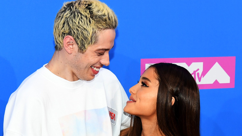 Pete Davidson and Ariana Grande posing together at MTV VMAs