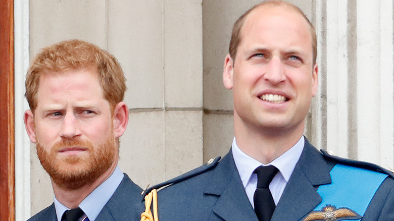 Prince Harry watching behind Prince William