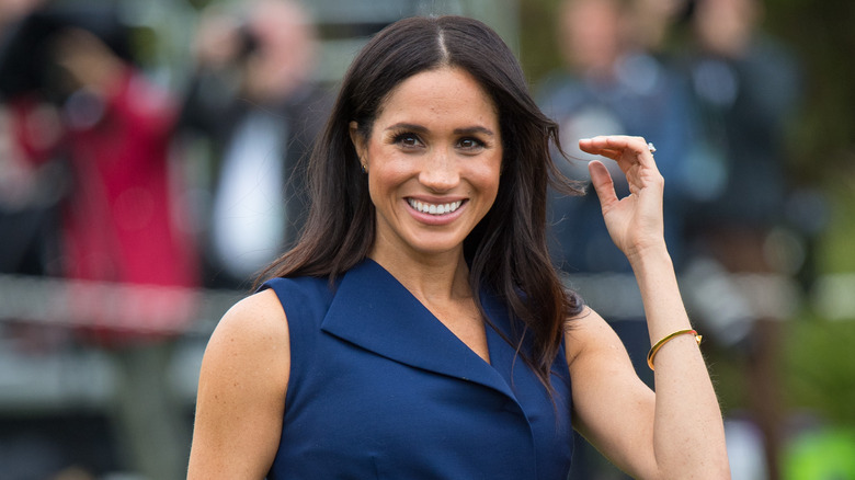 Meghan Markle smiles for photographers 