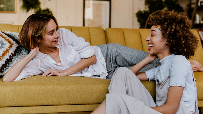 two women talking and smiling