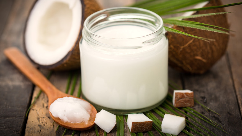 coconut inside jar with spoon