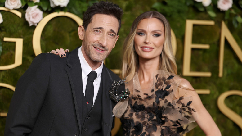 Adrien Brody and Georgina Chapman posing for photos