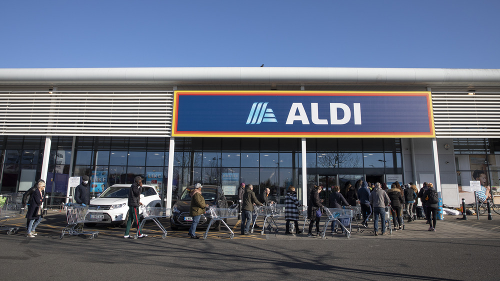 Aldi customers enter store