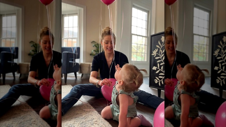 Amber Heard and her daughter Oonagh playing with balloons on Oonagh's first birthday