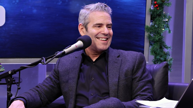 journalist Andy Cohen with a microphone