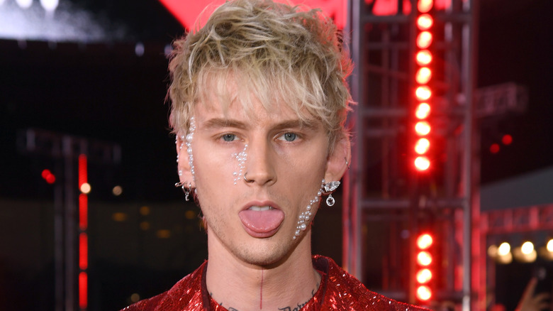 Machine Gun Kelly sticking his tongue out