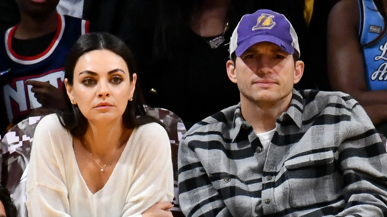 Ashton Kutcher and Mila Kunis courtside