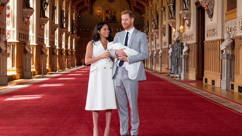 Meghan and Harry posing for photo with son Archie