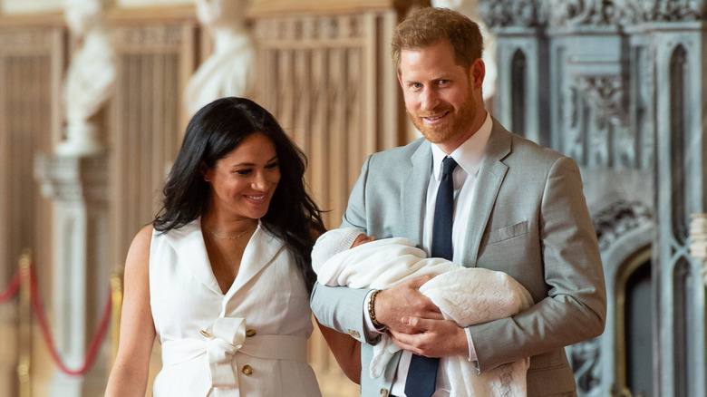 Harry and Meghan walking with baby Archie