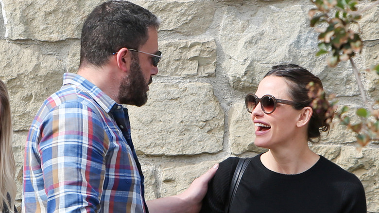 Ben Affleck touches smiling Jennifer Garner's shoulder