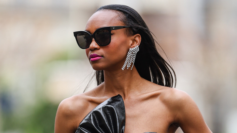 Model wearing fringe earrings