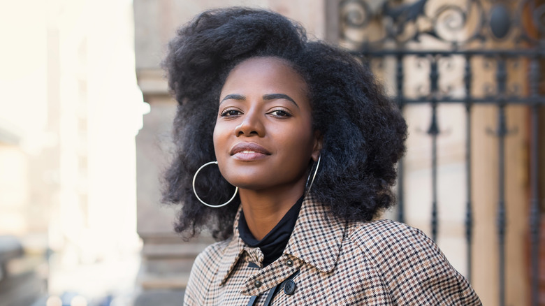 Woman wearing large hoops