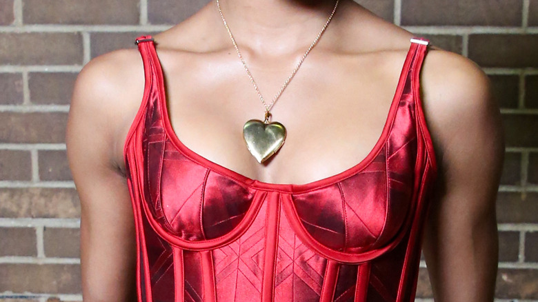 Model wearing heart pendant