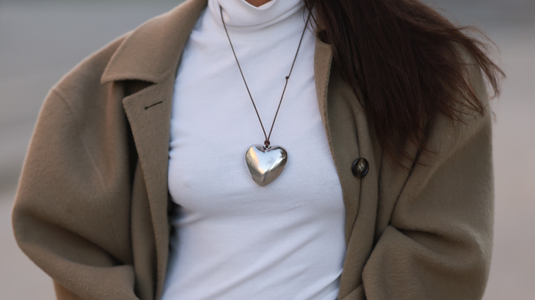 Model wearing heart necklace