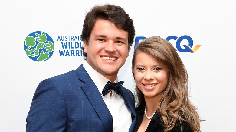 Bindi Irwin and Chandler Powell posing on the red carpet 