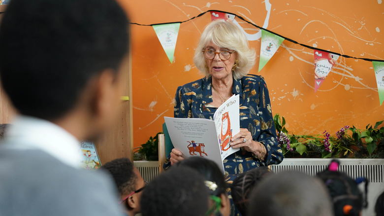 Queen Camilla reading to elementary school students