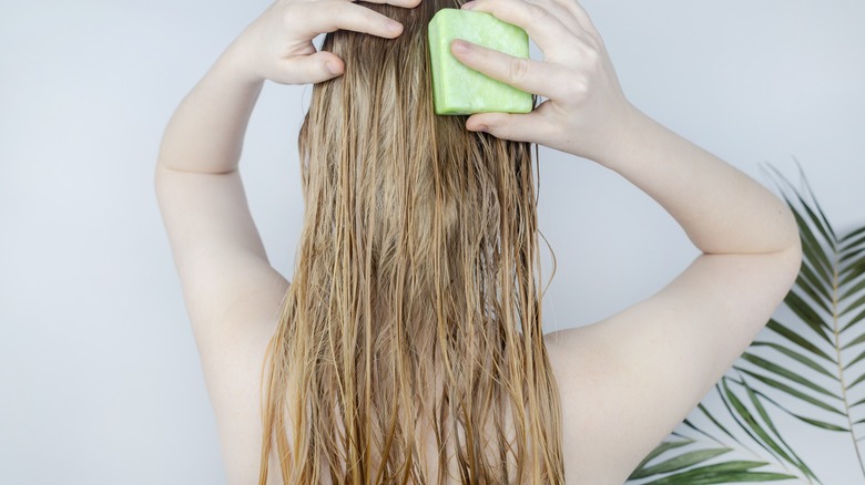 blonde woman washing hair