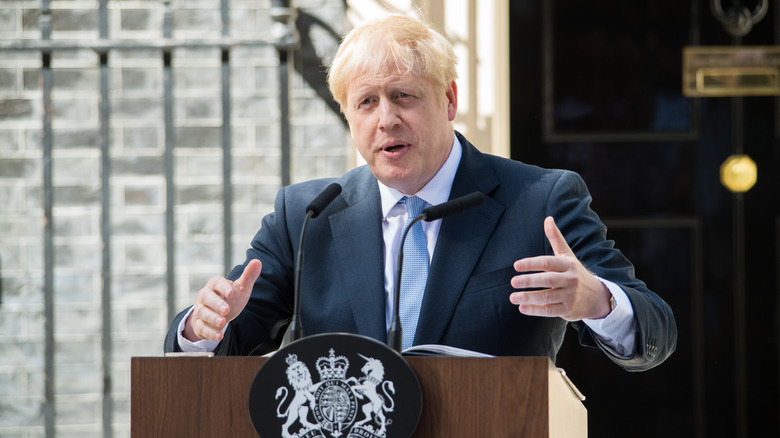 Boris Johnson speaking at podium