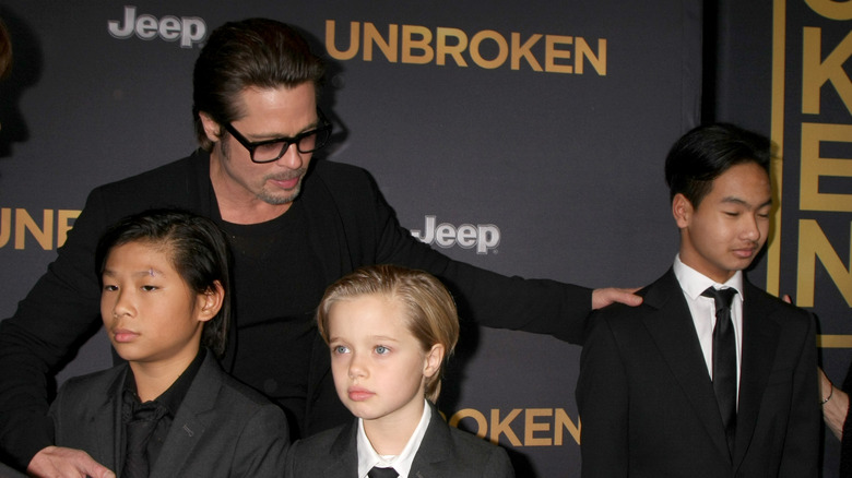 Brad Pitt attends the premiere of Unbroken with kids Pax, Shiloh, and Maddox