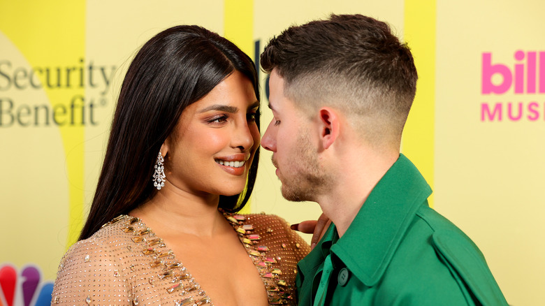 Priyanka Chopra and Nick Jonas share a moment on the red carpet at the 2021 Billboard Awards