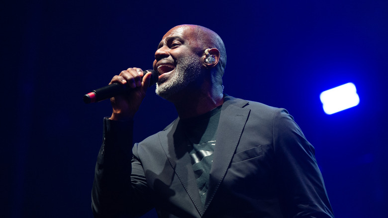 Brian McKnight sings in black suit