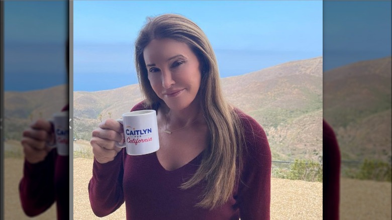 Caitlyn Jenner posing with mug outside