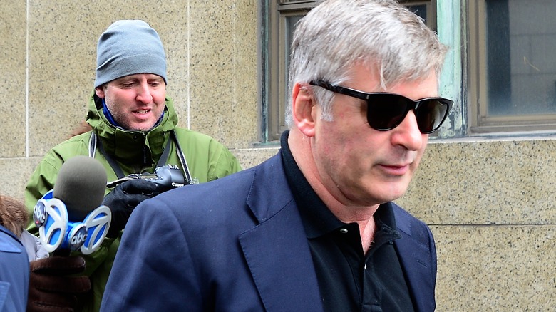 Alec Baldwin is trailed by photographers