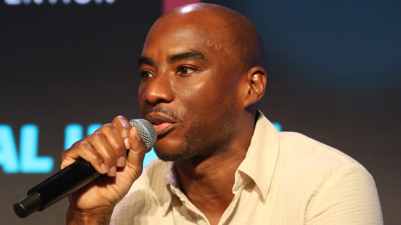 Charlamagne Tha God speaking at a summit