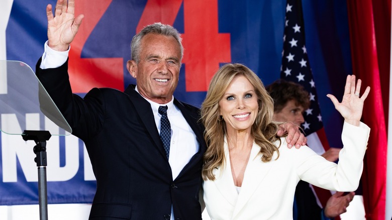 spouses Cheryl Hines and RFK Jr. waving