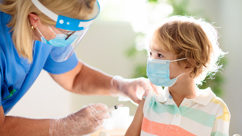 Child getting covid-19 vaccine