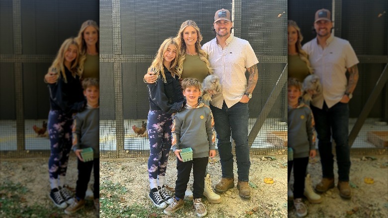 Christina on the farm with two of her children and husband Josh