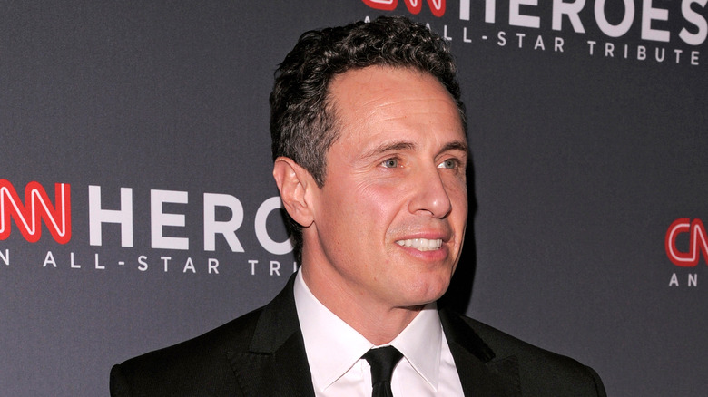 Chris Cuomo in a black suit at a CNN Heroes event