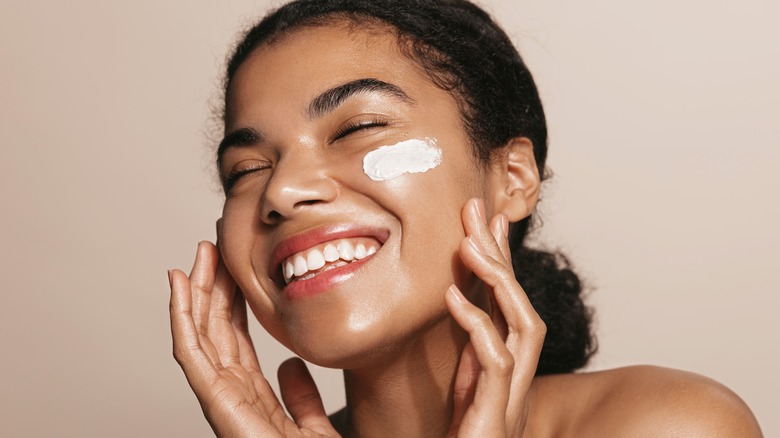 Woman applying primer