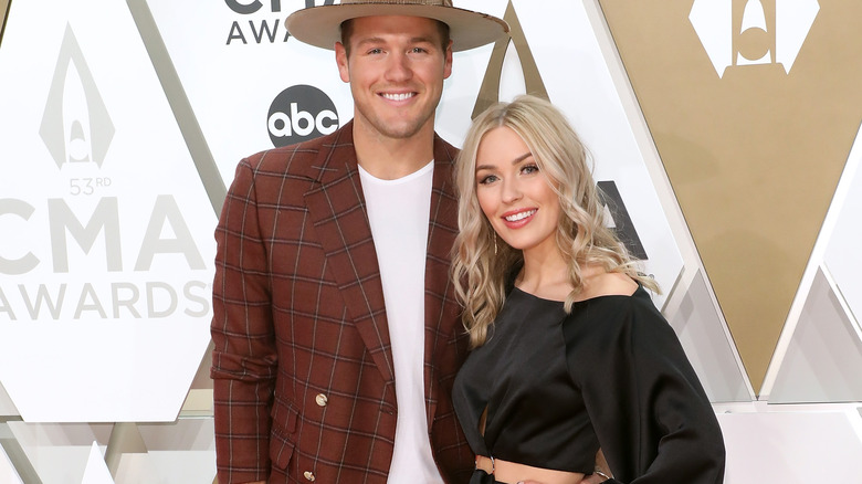 Colton Underwood and Cassie Underwood pose together and smile