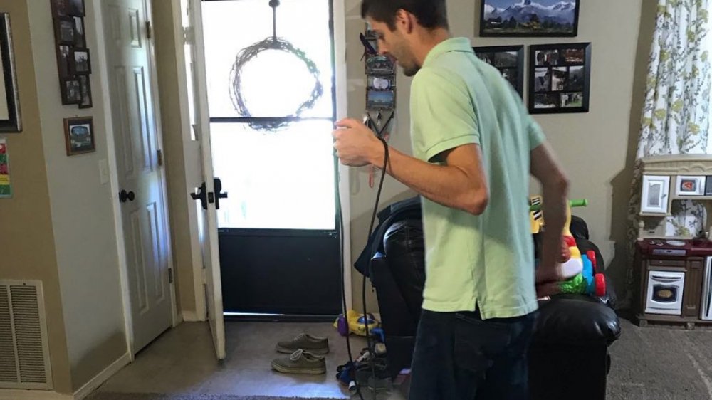 Derick with a vacuum cleaner